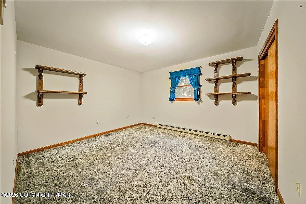 Dallas NY secondary bedroom after — repainted, new carpet installed