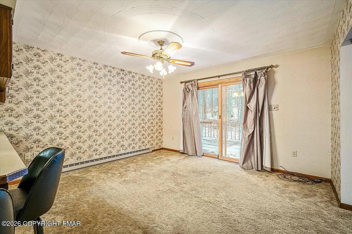 Dallas NY living room after — wallpaper removed, neutral walls, decluttered
