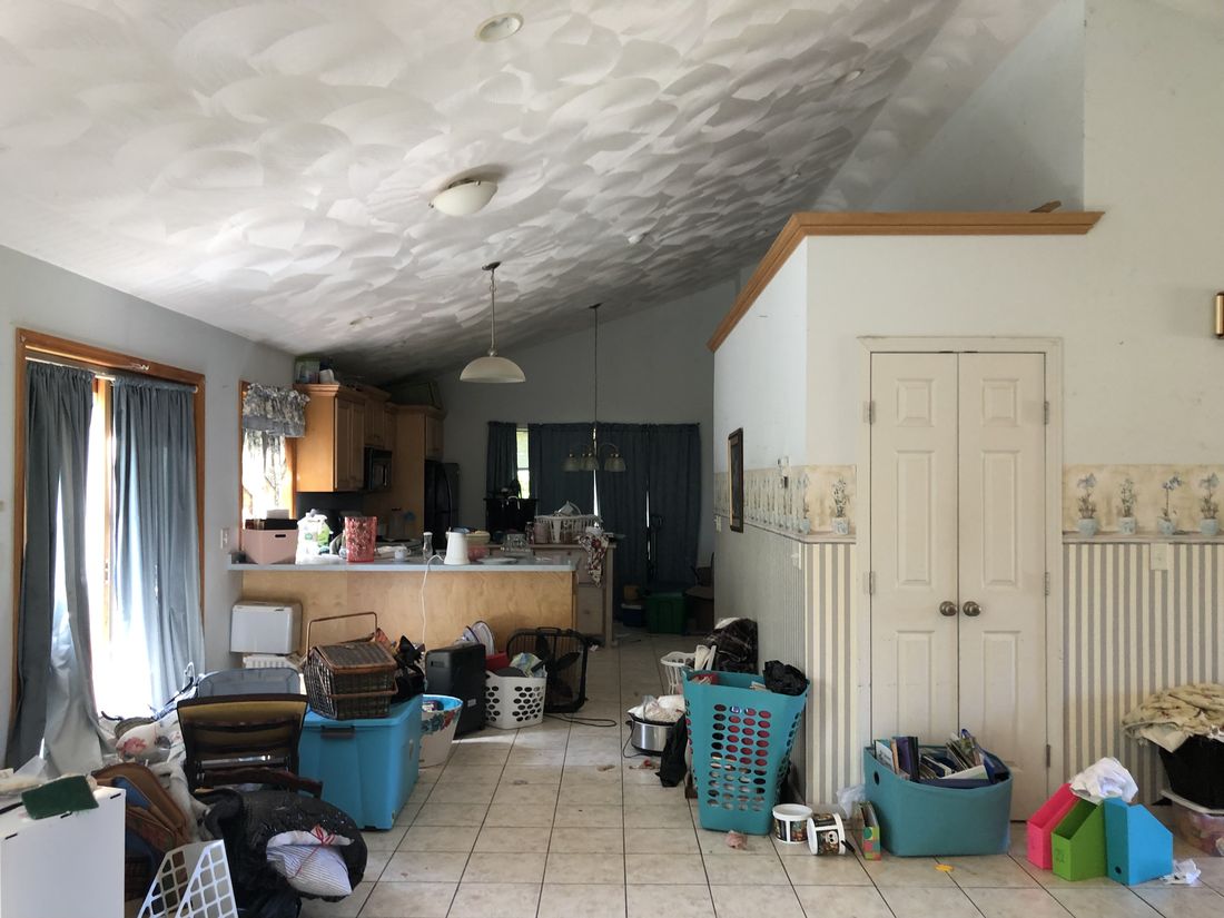 Living area with cathedral ceiling in the Holland Patent home, photographed as purchased