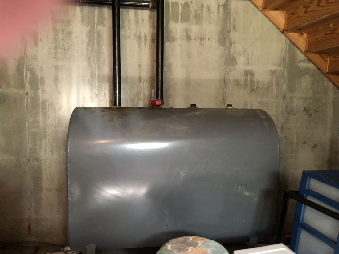 Basement oil storage tank serving the Holland Patent home's heating system