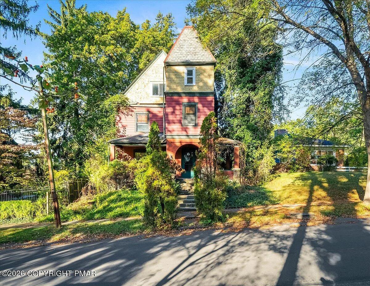 1901 Victorian after — turret, fish-scale shingles, street view