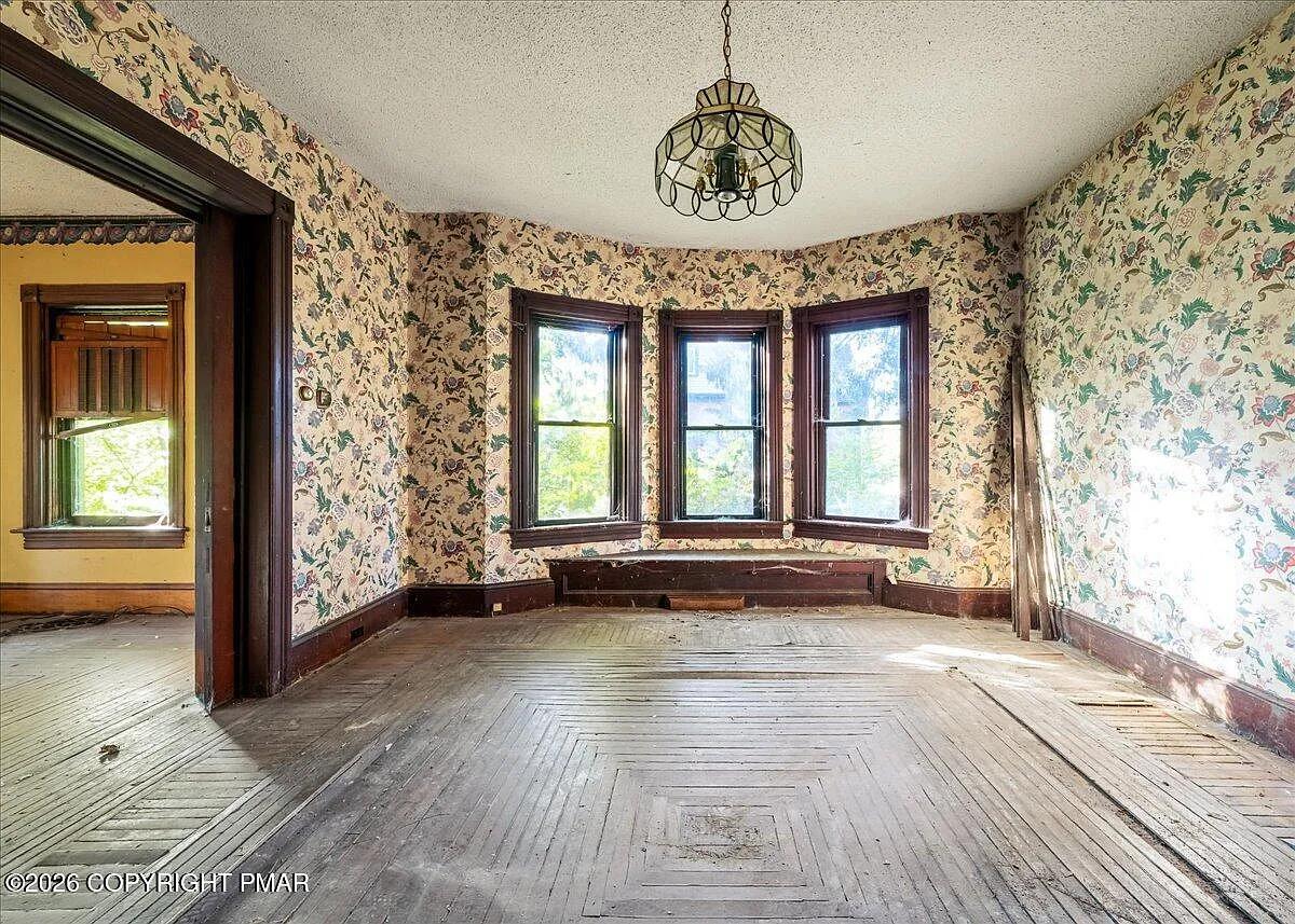 Victorian parlor with bay windows — the Hudson Valley NY housing market 2026