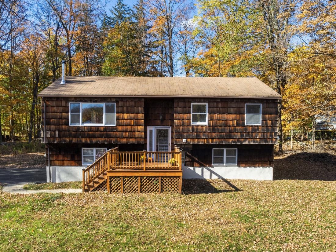 1979 High Ranch in Yorktown Heights, NY after renovation with cedar shake siding